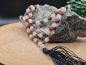 Preview: Handgefertigte Rudraksha & Quartz Mala aus Nepal mit feinen Metall-Spacern und schwarzer Quaste.